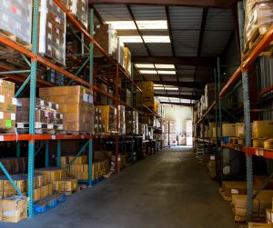 Warehouse with shelves of growers supply.